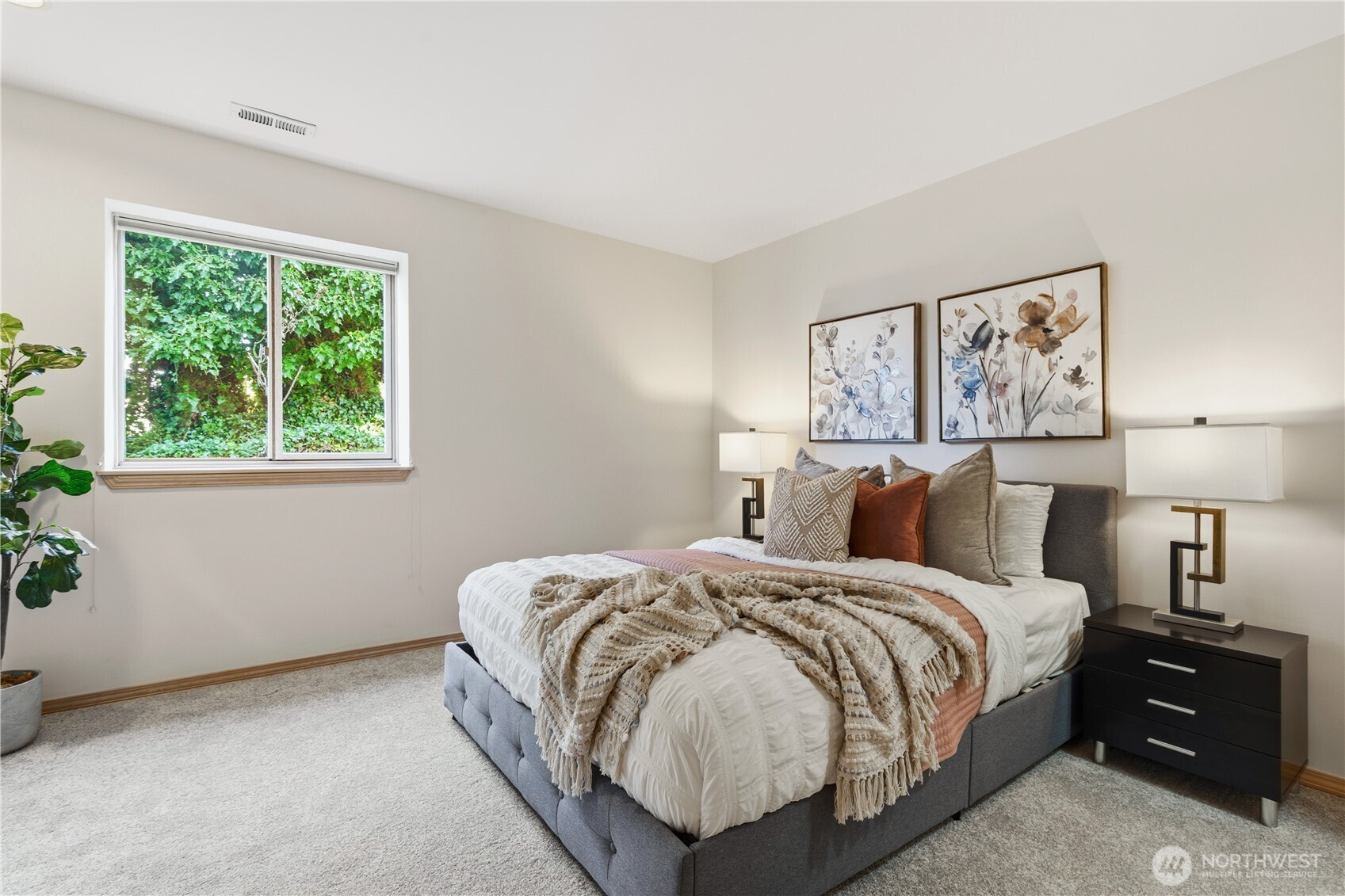 2626 Northwest 204th Street Shoreline, WA 98177 - Photo 29 of 35 a bed room with a bed and a night stand