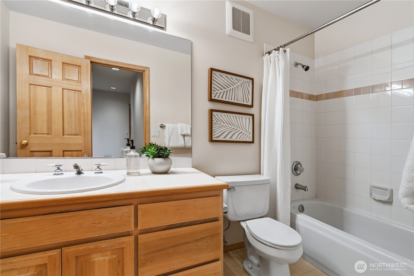 2626 Northwest 204th Street Shoreline, WA 98177 - Photo 31 of 35 a bathroom with a sink toilet and shower