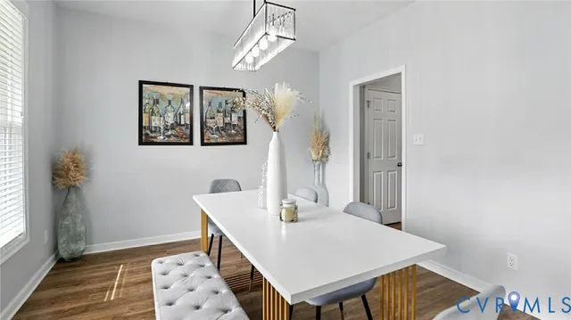 a bathroom with a sink a toilet a mirror and shower