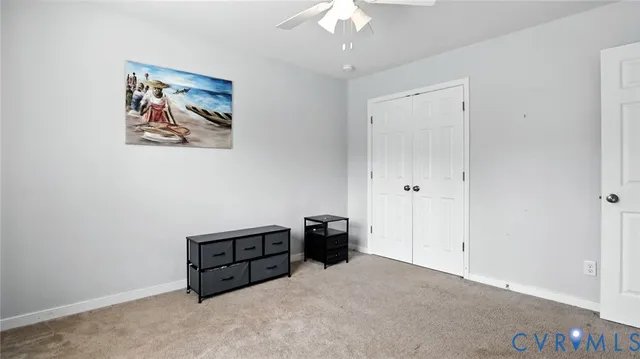 a view of a house with a big yard and large trees