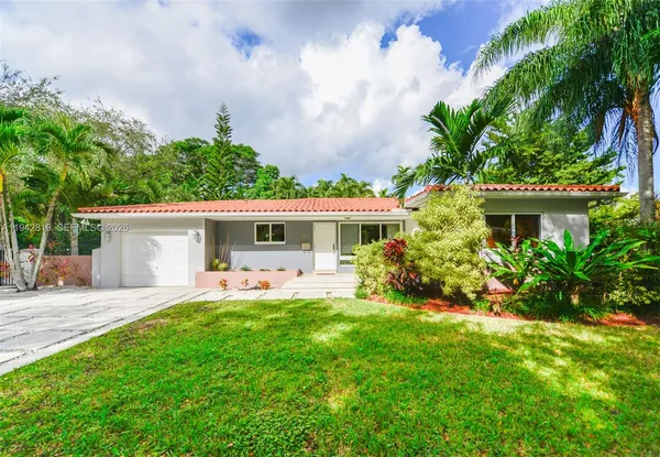 front view of a house with a yard