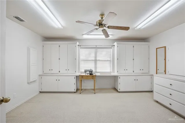 a view of a kitchen with furniture and cabinet area