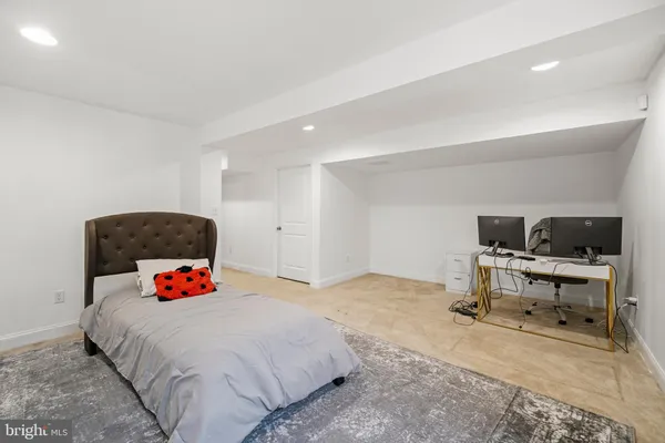 a bedroom with a bed and dresser