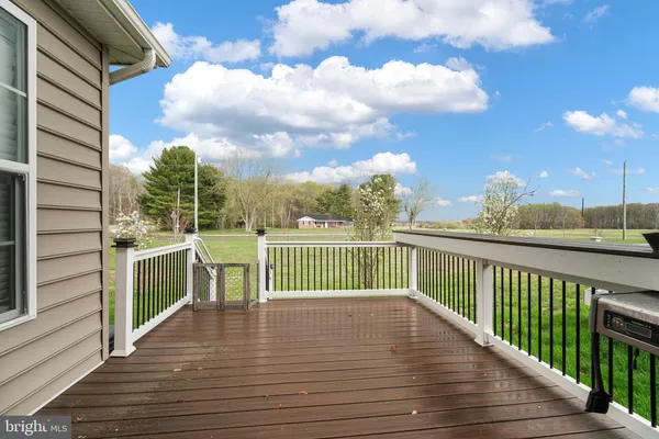 a view of a house with wooden deck
