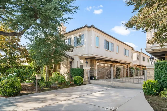 a view of a street with houses on both side