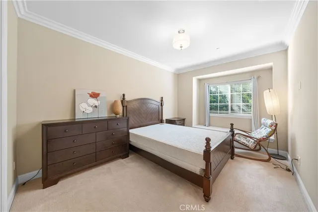 a bedroom with a bed and a chair