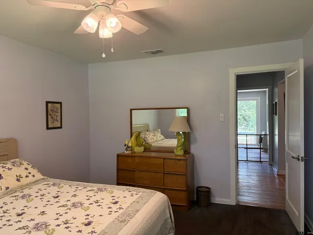 a bathroom with a sink vanity and mirror