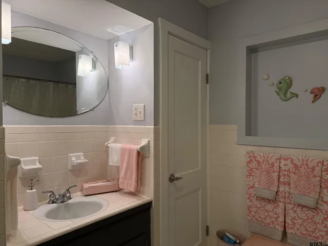 a bathroom with a shower curtain and a shower curtain