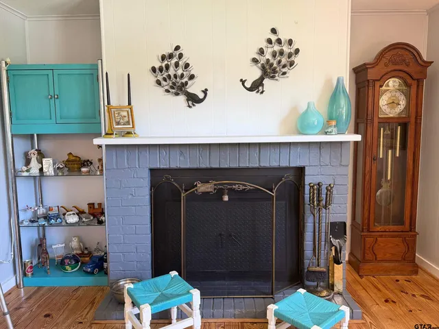 a spacious bedroom with a bed and a chandelier
