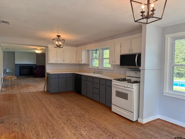 a bed room with furniture and a chandelier
