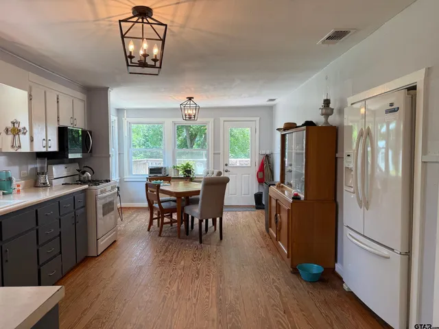 a view of a park with large trees