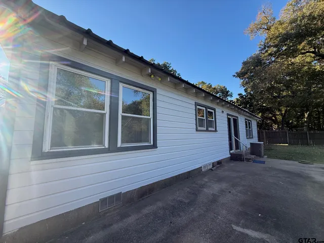 a backyard of a house with lots of green space