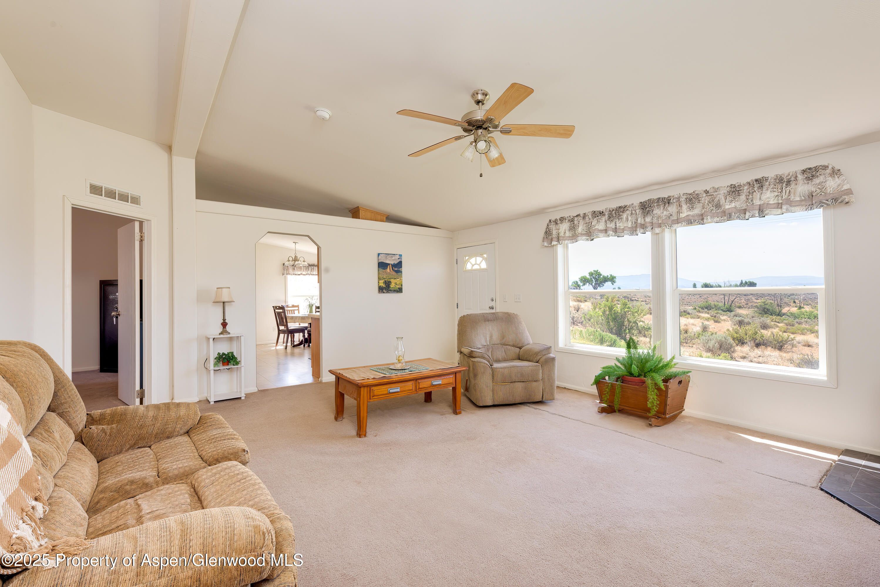 114 Rusty Spur Trail Rifle, CO 81650 - Photo 17 of 47 a living room with furniture and a large window