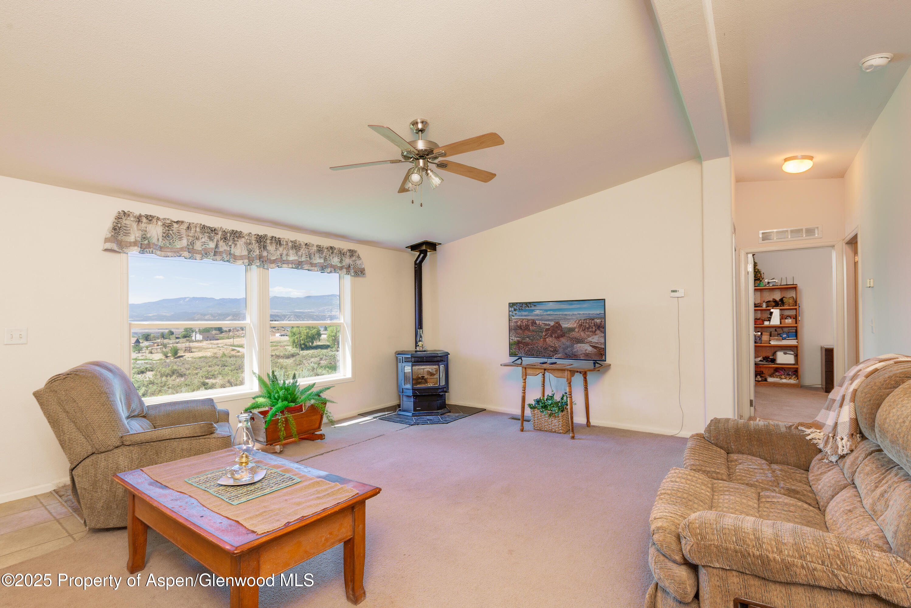 114 Rusty Spur Trail Rifle, CO 81650 - Photo 18 of 47 a living room with furniture and a large window