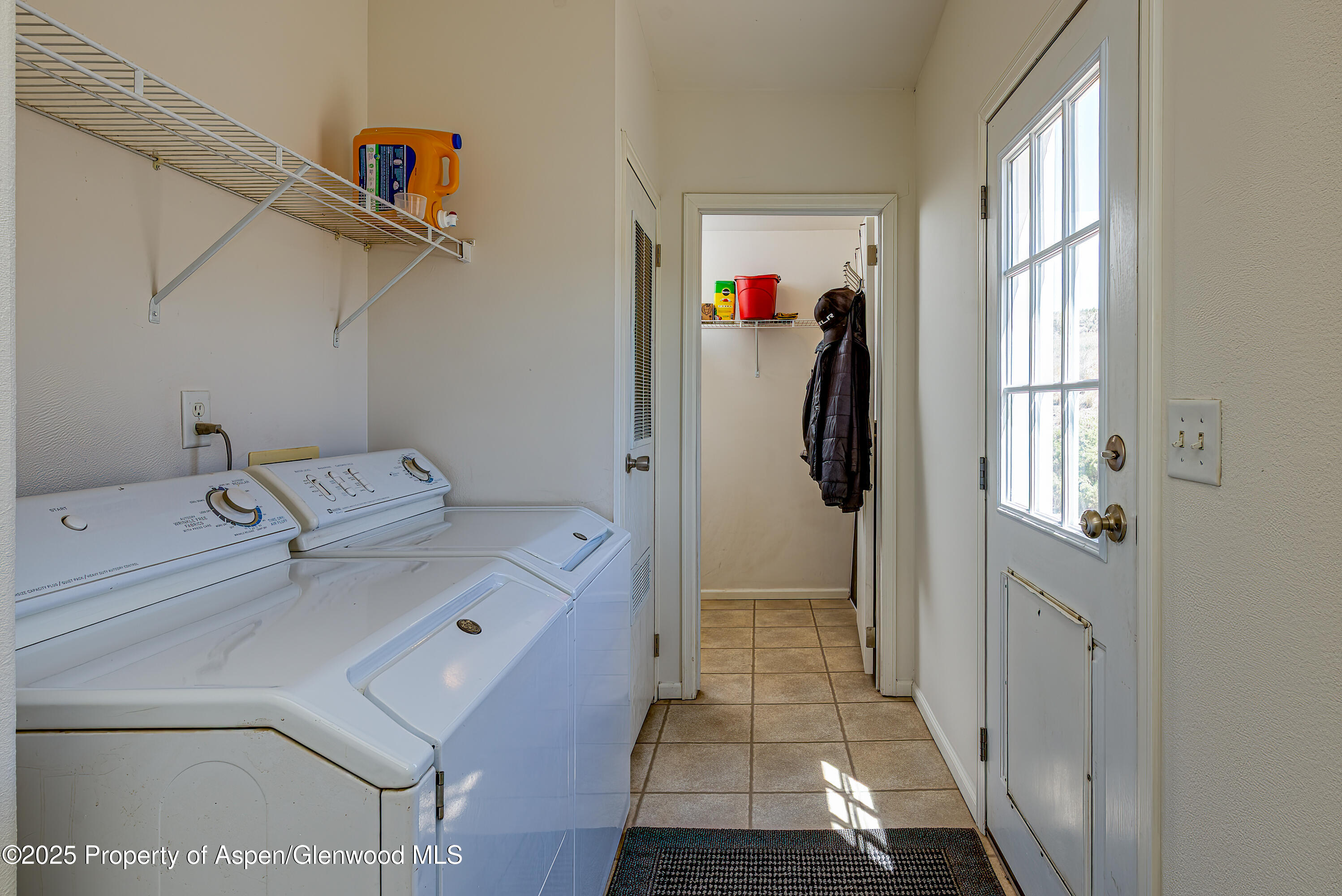 114 Rusty Spur Trail Rifle, CO 81650 - Photo 29 of 47 a utility room with dryer and washer