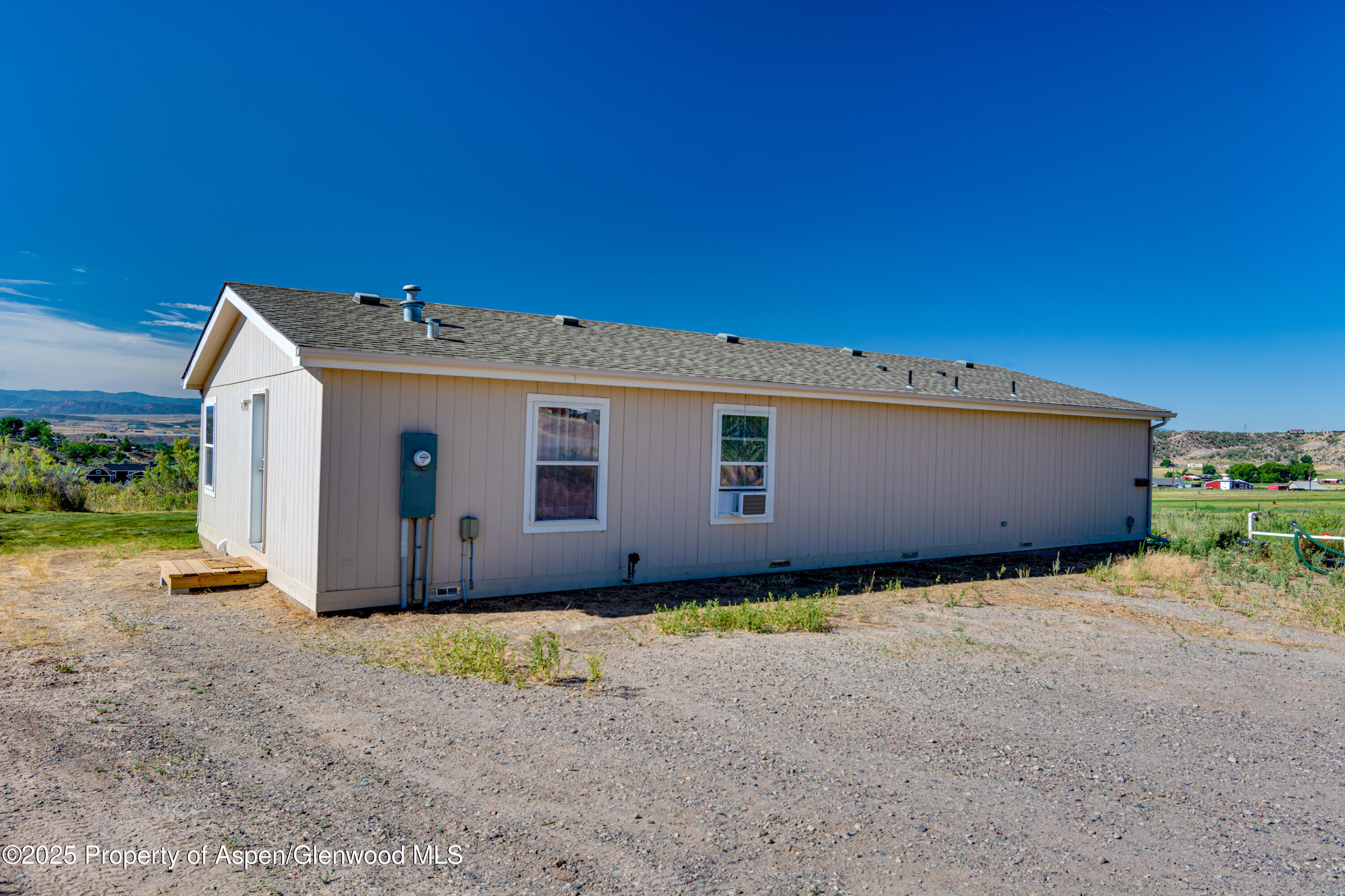 114 Rusty Spur Trail Rifle, CO 81650 - Photo 31 of 47 a front view of a house with a yard