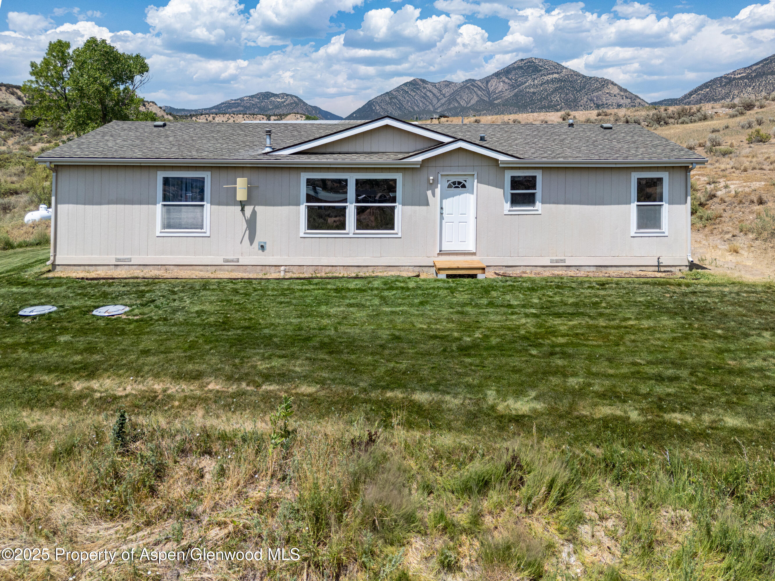 114 Rusty Spur Trail Rifle, CO 81650 - Photo 9 of 47 a view of a house with a backyard