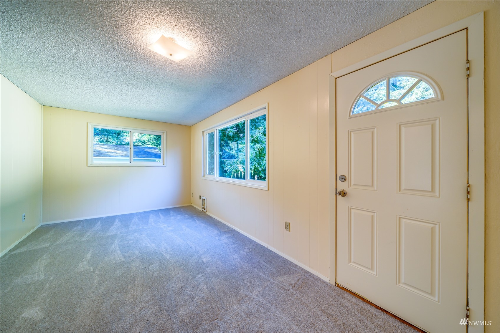 809 Dyer Road Sultan, WA 98294 - Photo 13 of 39 an empty room with windows and entrance