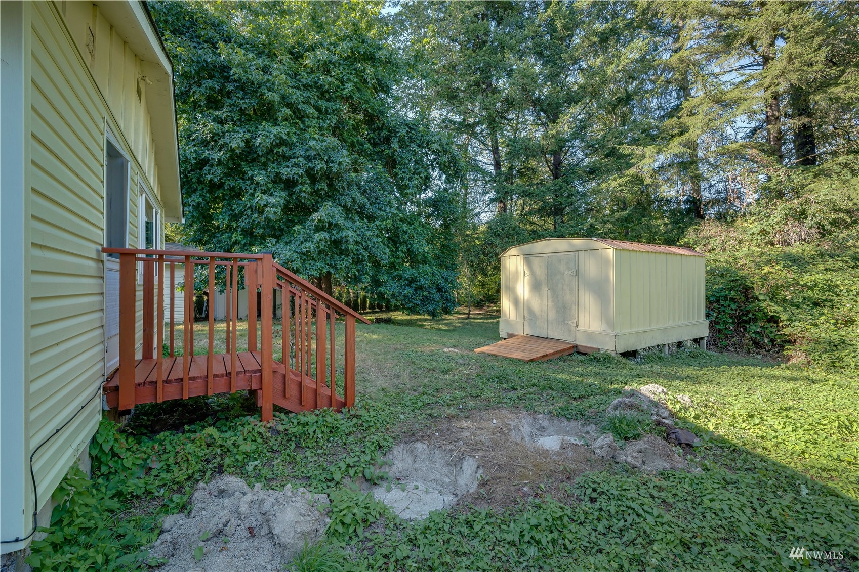 809 Dyer Road Sultan, WA 98294 - Photo 22 of 39 a view of backyard with tub and trees
