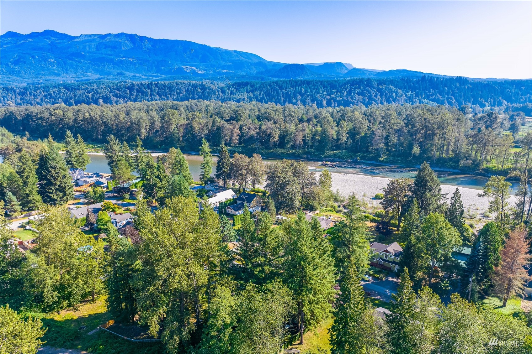 809 Dyer Road Sultan, WA 98294 - Photo 33 of 39 a view of a lush green field with mountains in the background