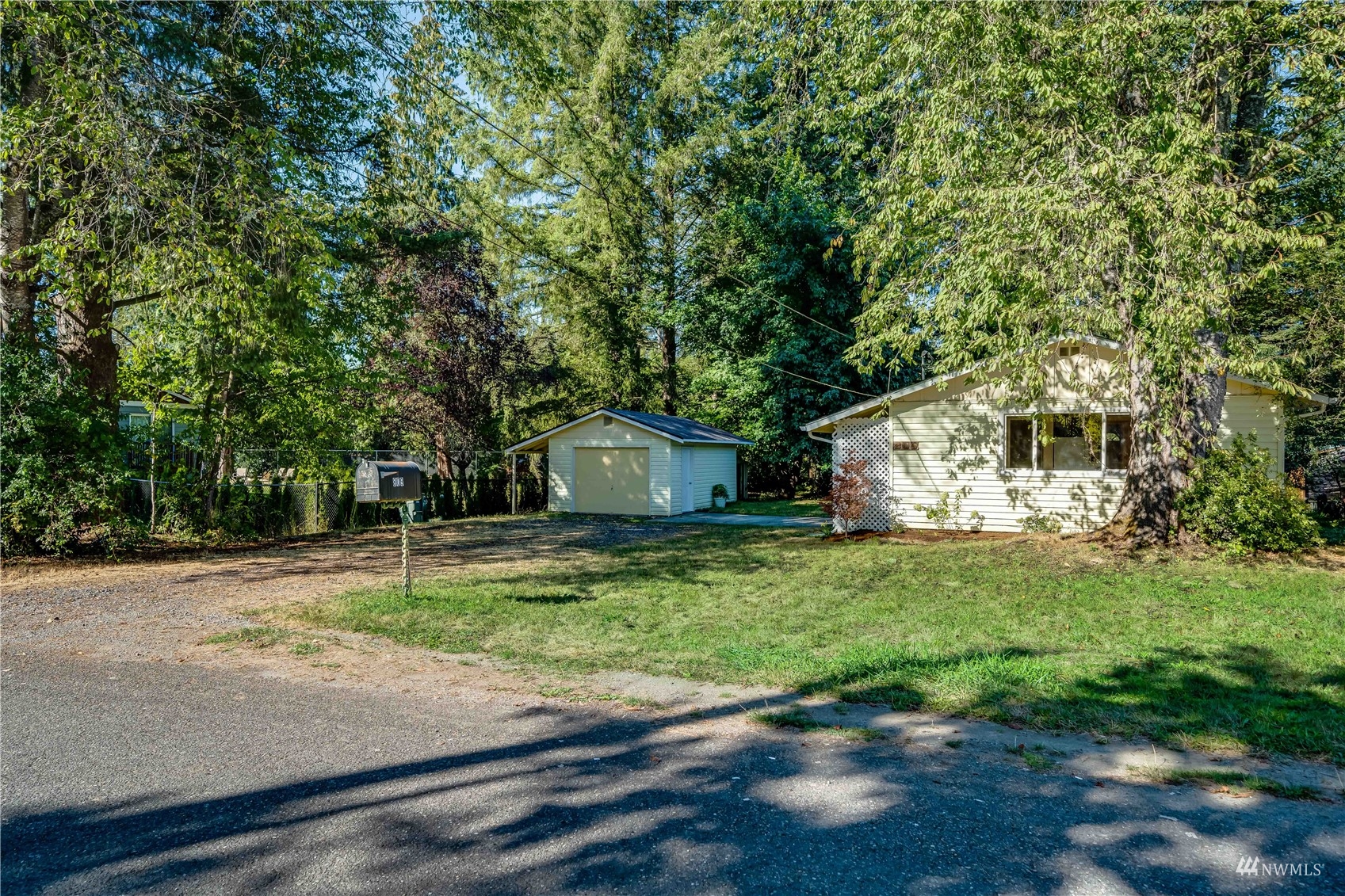 809 Dyer Road Sultan, WA 98294 - Photo 39 of 39 a white house that has a tree in front of it