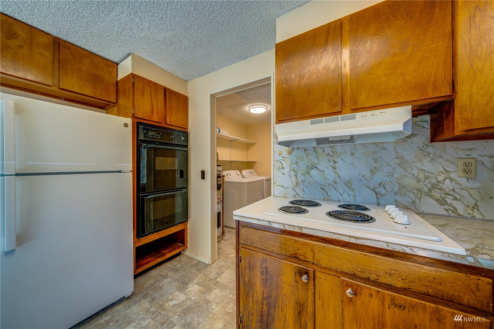 809 Dyer Road Sultan, WA 98294 - Photo 6 of 39 a kitchen with stainless steel appliances granite countertop a refrigerator a stove and a sink