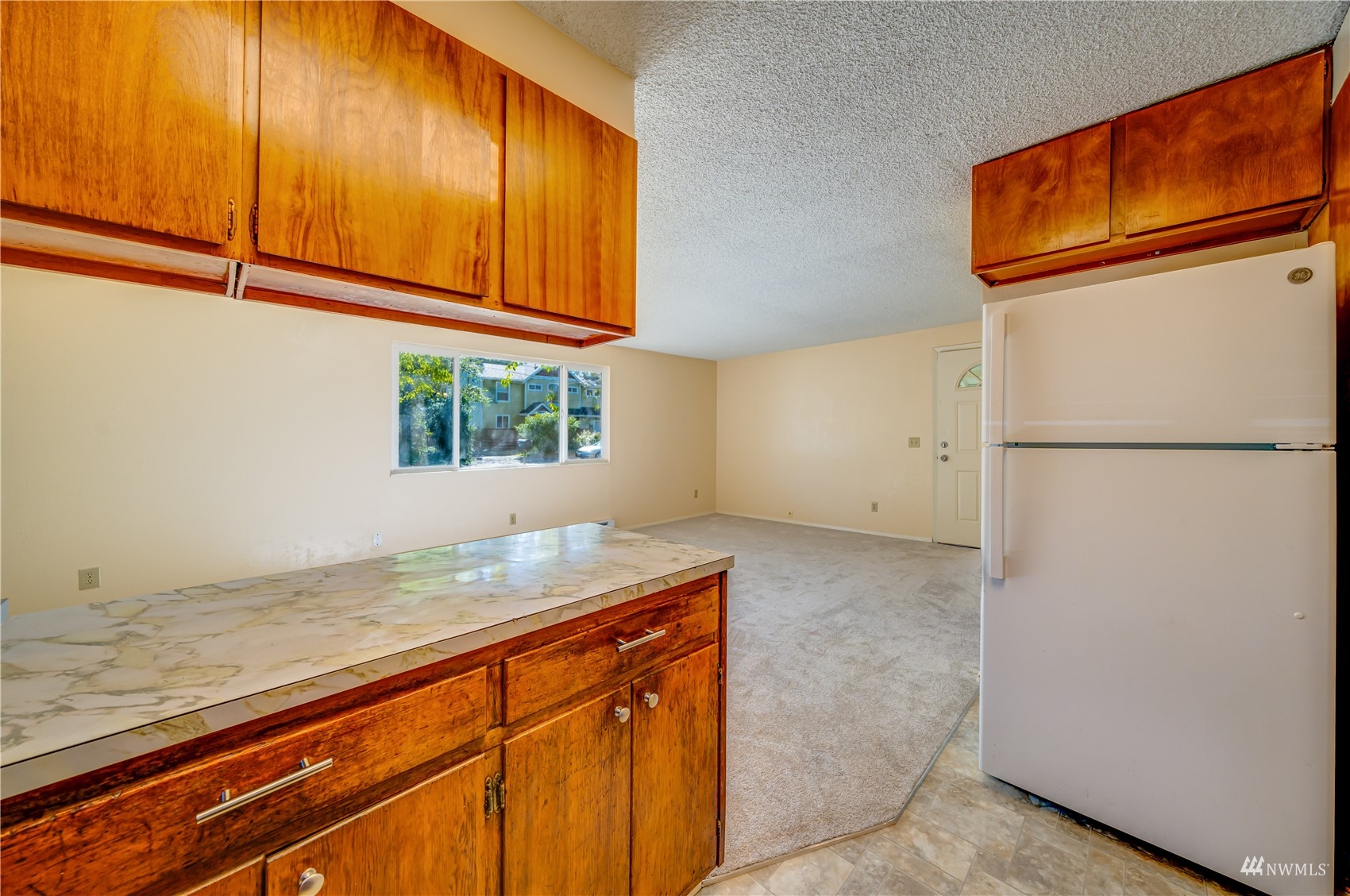 809 Dyer Road Sultan, WA 98294 - Photo 7 of 39 a kitchen with a sink and a refrigerator