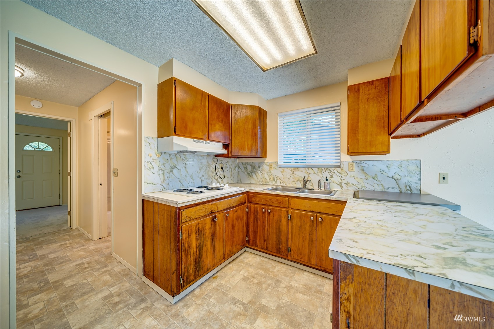 809 Dyer Road Sultan, WA 98294 - Photo 8 of 39 a kitchen with stainless steel appliances granite countertop wooden cabinets a sink and dishwasher