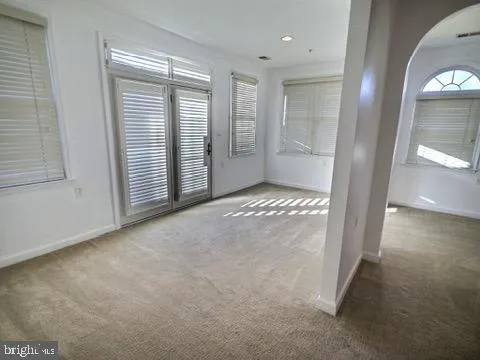 an empty room with windows