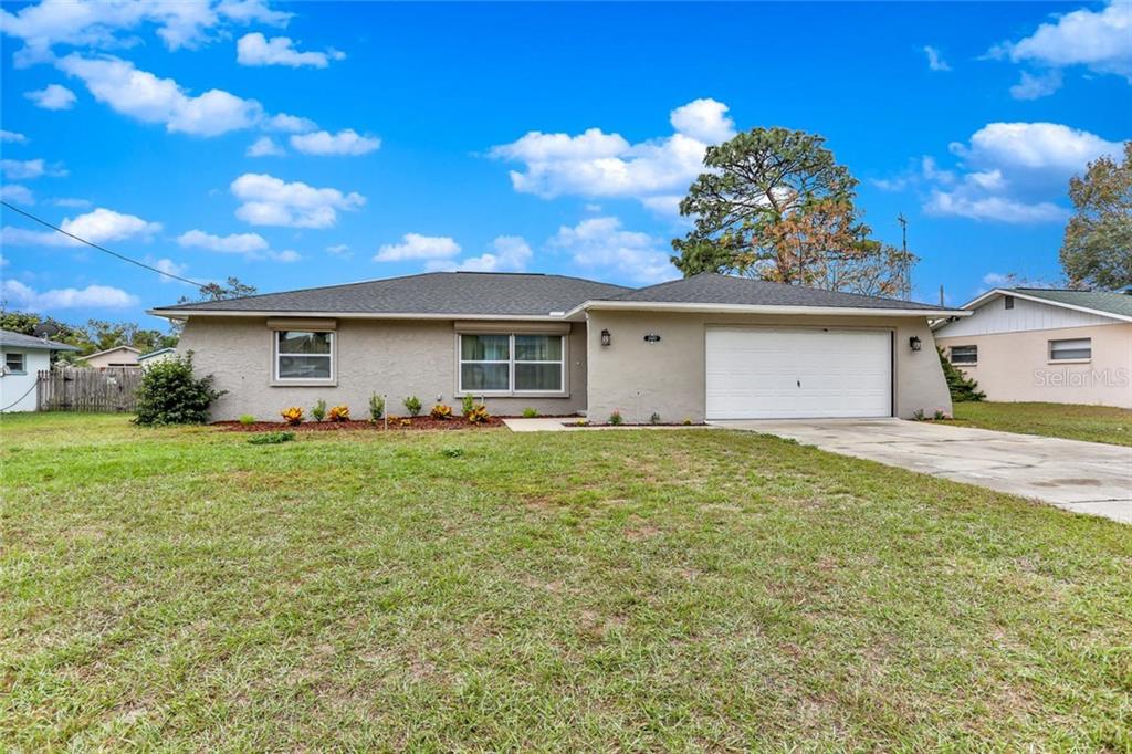 2407 Keeport Drive Spring Hill, FL 34609 - Photo 1 of 1 a view of a house with a yard