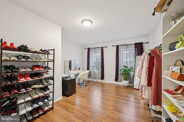 a view of a bedroom with furniture and entryway