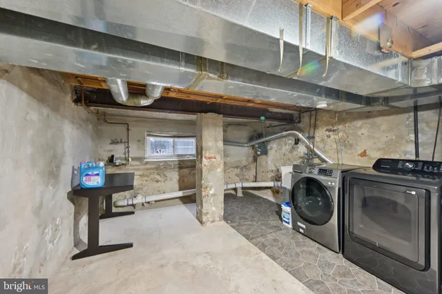 a view of a house with a yard and potted plants