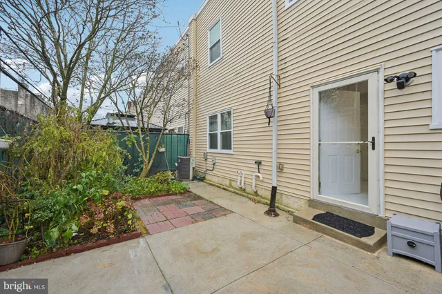 a view of a chair and tables in the patio