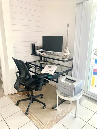 a living room with furniture and a gate