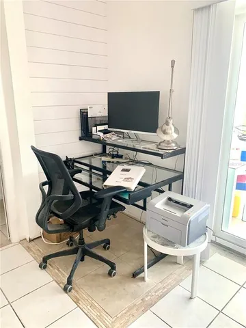 a living room with furniture and a gate