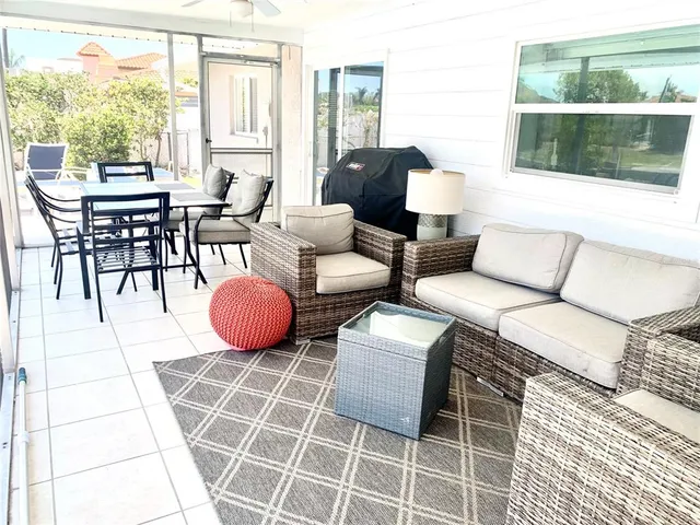 a view of house with backyard and glass windows