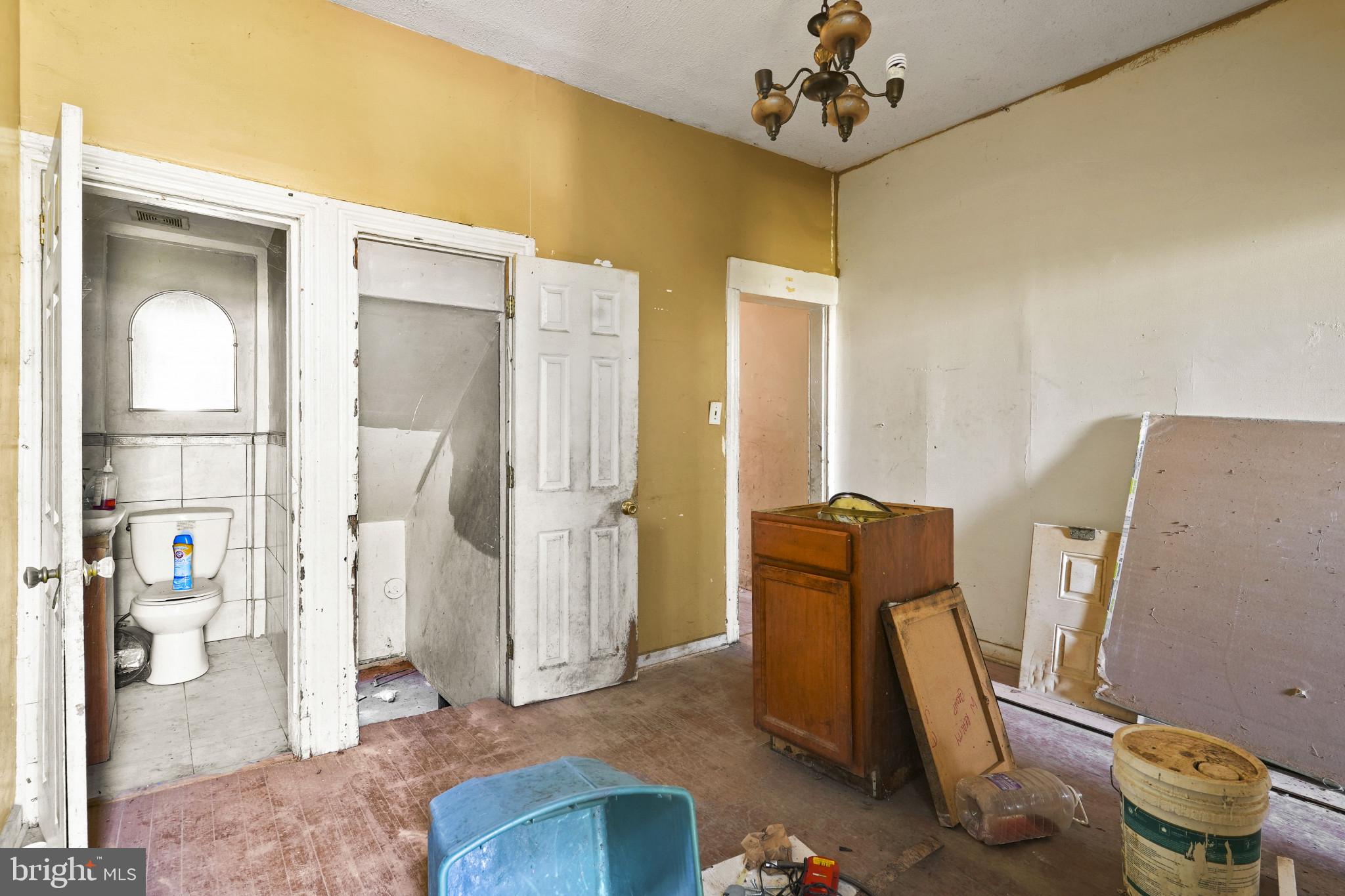 2121 Division Street Baltimore, MD 21217 - Photo 7 of 18 a view of living room with furniture and a chandelier