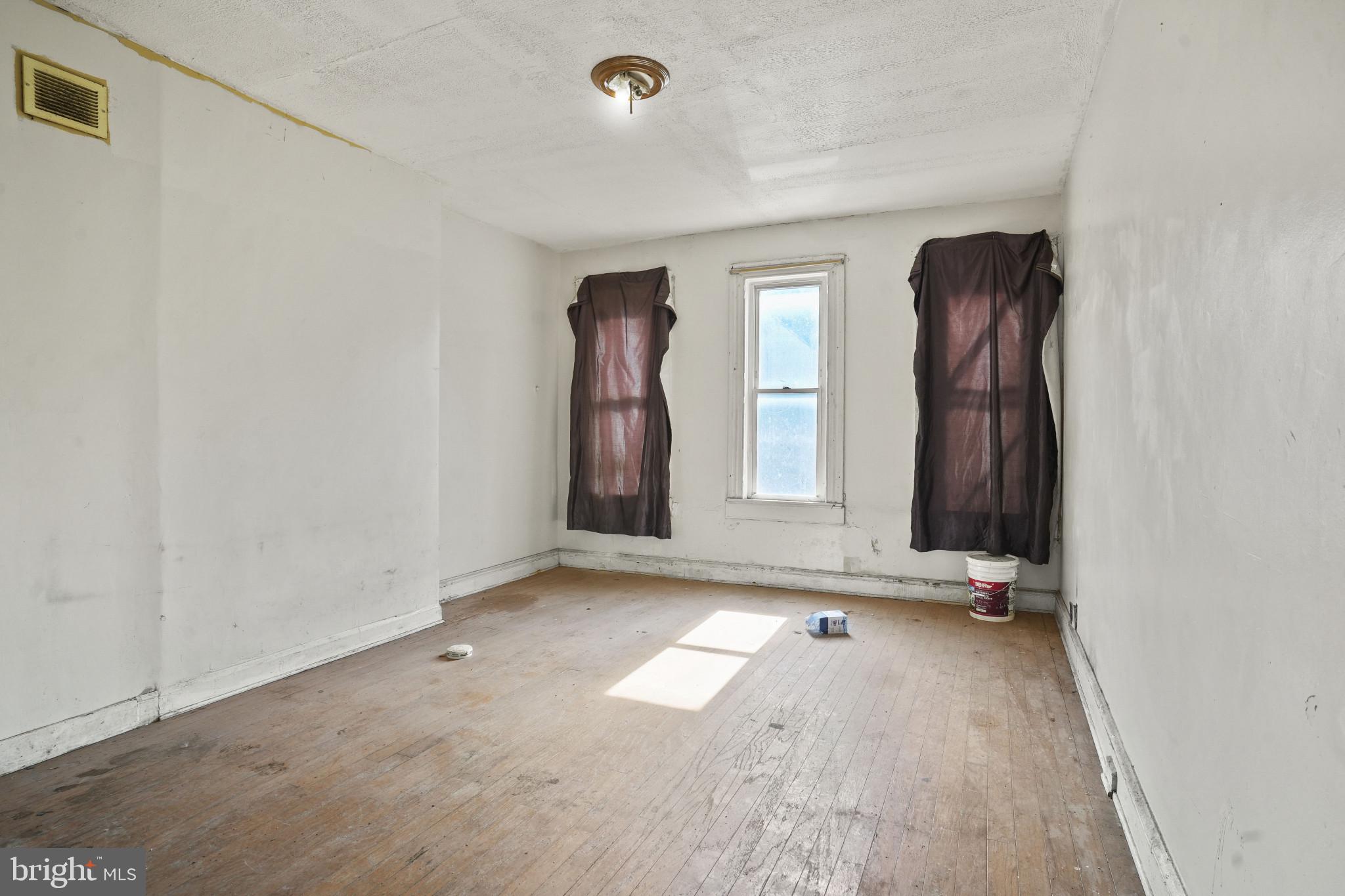 2121 Division Street Baltimore, MD 21217 - Photo 9 of 18 an empty room with windows