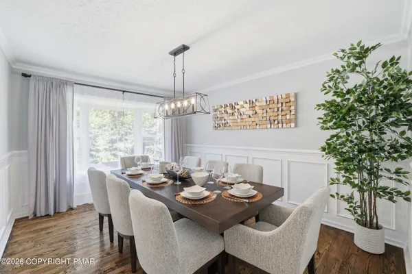a view of a dining room with furniture window and outside view