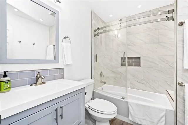 a bathroom with a sink a toilet and a bathtub