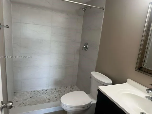 a bathroom with a sink and shower