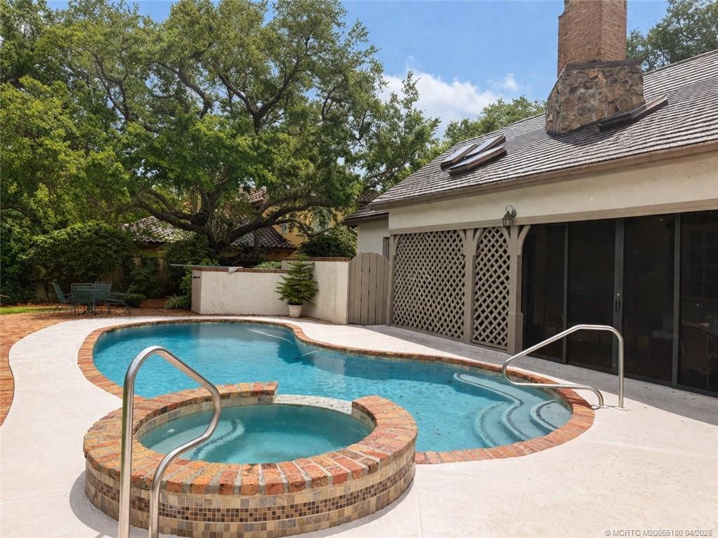 10 Pineapple Lane Stuart, FL 34996 - Photo 6 of 9 a view of swimming pool with seating space