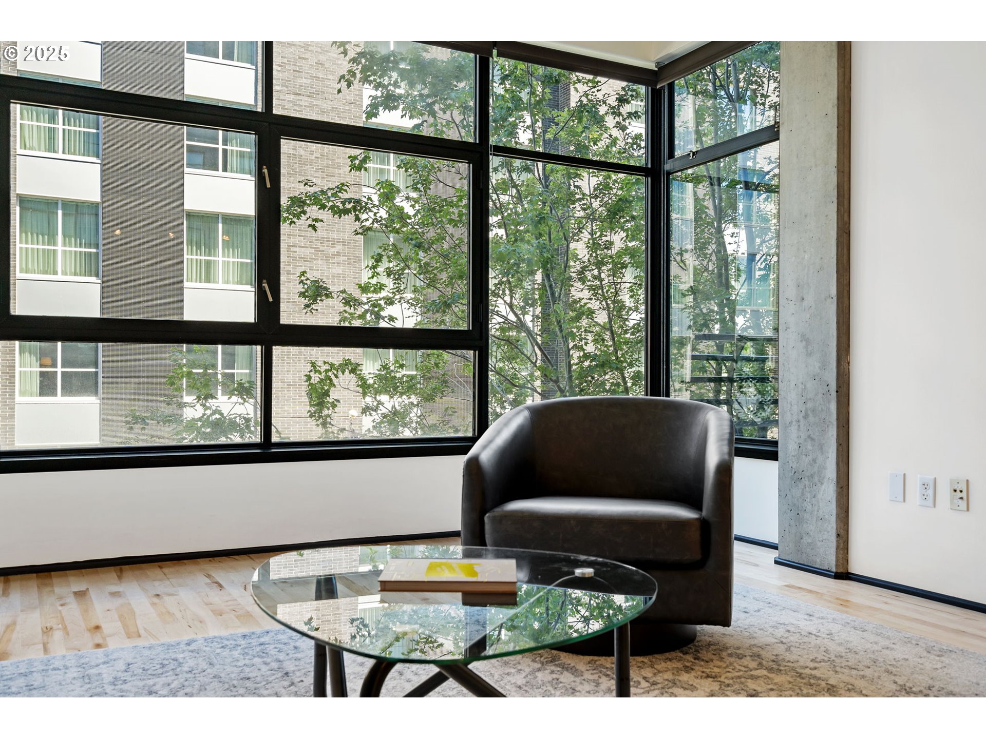 333 Northwest 9th Avenue, Unit 411 Portland, OR 97209 - Photo 11 of 32 a living room with furniture and a window