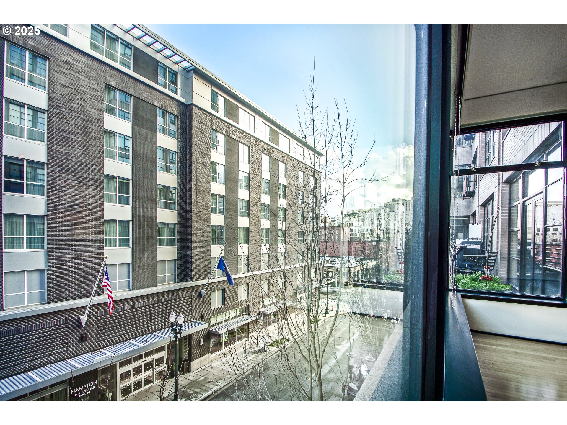 333 Northwest 9th Avenue, Unit 411 Portland, OR 97209 - Photo 12 of 32 a picture of a floor to ceiling window and wooden floor