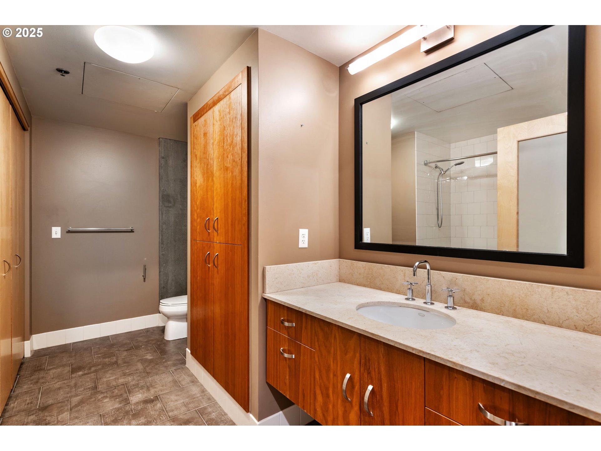 333 Northwest 9th Avenue, Unit 411 Portland, OR 97209 - Photo 24 of 32 a bathroom with a sink a toilet and shower