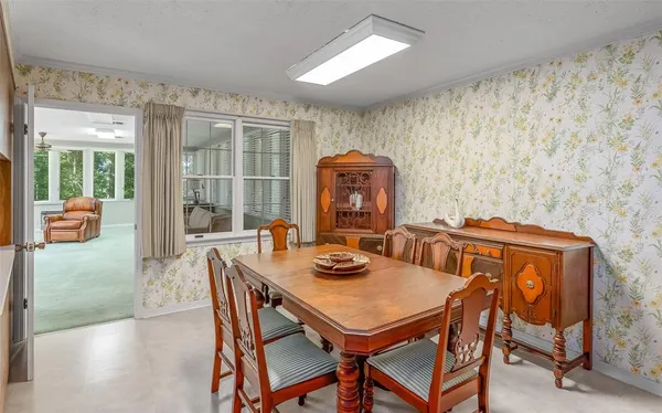 a view of a dining room with furniture window and outside view