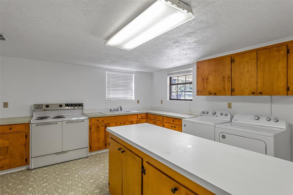 741 Beverly Drive Homer, LA 71040 - Photo 25 of 30 a view of a kitchen with sink and microwave