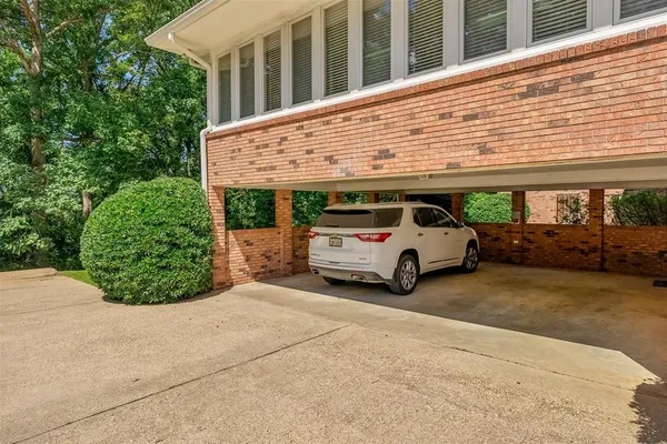 a view of a car parked front of a house