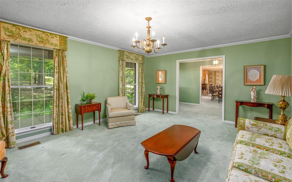 741 Beverly Drive Homer, LA 71040 - Photo 5 of 30 a living room with furniture and a chandelier