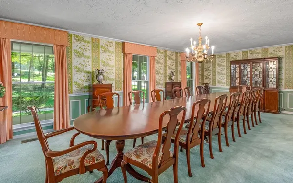 a view of a dining room with furniture window and outside view
